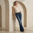 Women’s mid waist slim fit flared jeans by FJØRNA, showing stretch denim fabric and stylish flare leg design.