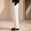 FJØRNA men's wide-leg pleated trousers with relaxed fit, stylish and comfortable pants for modern casual wear.