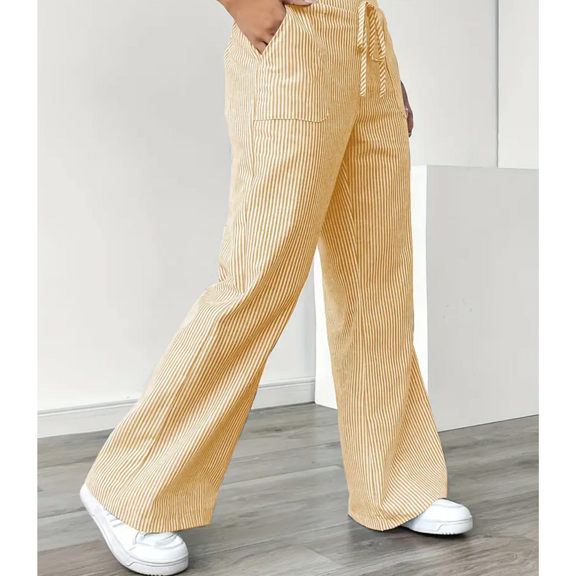 FJØRNA lightweight summer women’s trousers with drawstring waist, pockets, and breathable fabric for comfortable warm-weather wear.