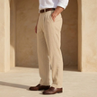 FJØRNA men's linen straight-leg trousers with pleats, lightweight and tailored for a modern, casual look.