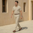FJØRNA men's linen blend straight leg trousers with pleats, relaxed fit, and classic style, shown on a model.