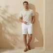 Men's linen blend shorts by FJØRNA with a tailored relaxed fit, showing the lightweight fabric and comfortable design.