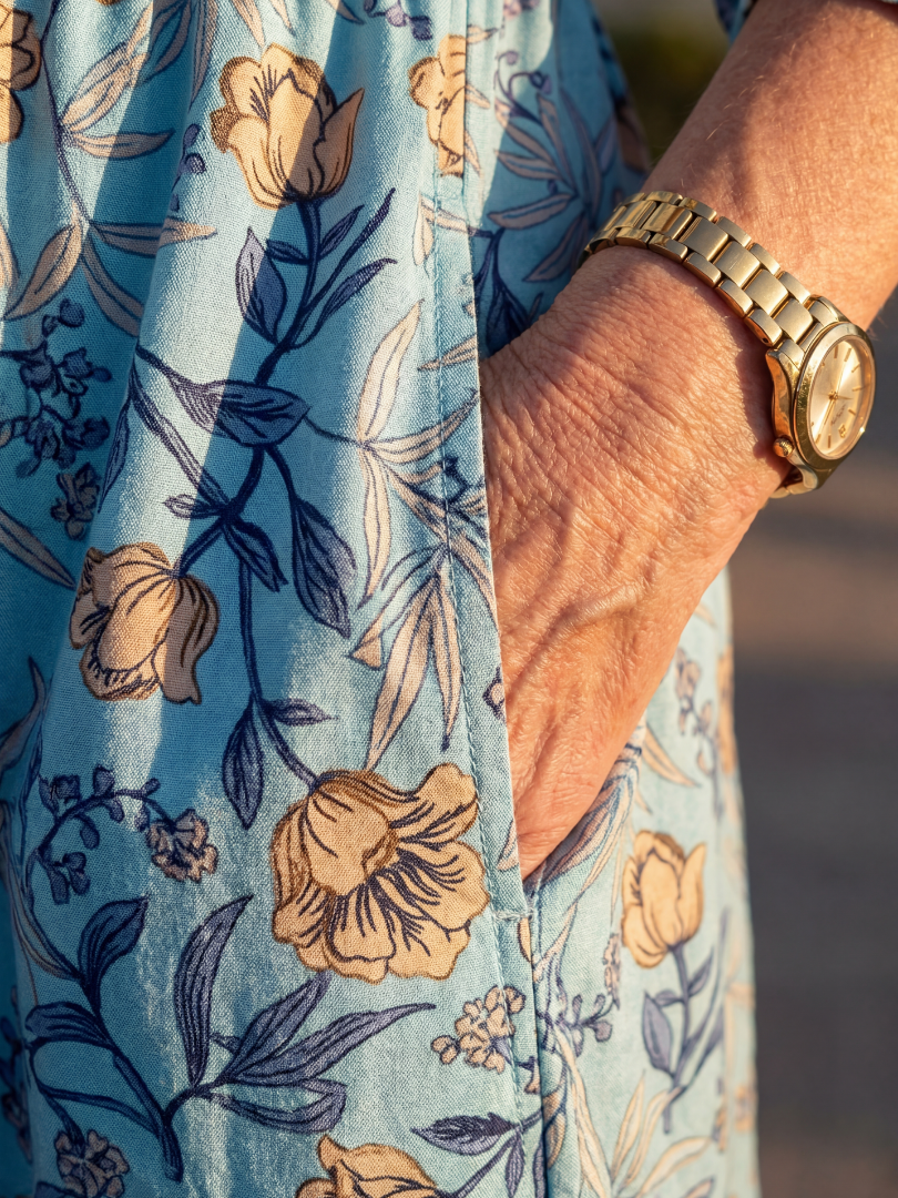 FJØRNA women's floral summer midi dress with short sleeves, wrap style, flowy fabric, perfect for warm weather.