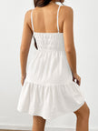 FJØRNA sleeveless white tiered sundress with drawstring detail, featuring a flowy design and lightweight fabric.