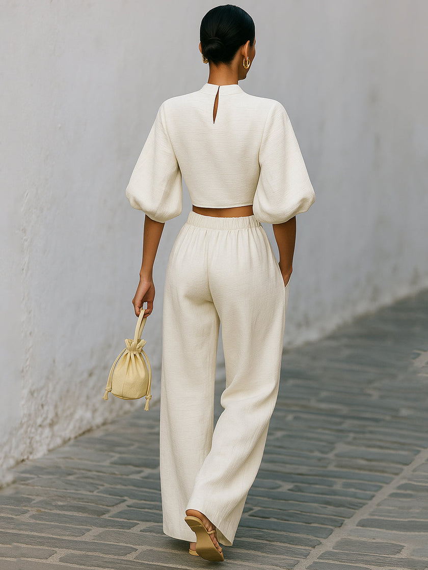 Cream textured lantern sleeve two-piece pants set by FJØRNA, featuring a stylish top and matching pants.