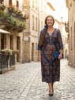 FJØRNA women's summer midi dress with long sleeves, wrap style, flowy fabric, perfect for warm weather.