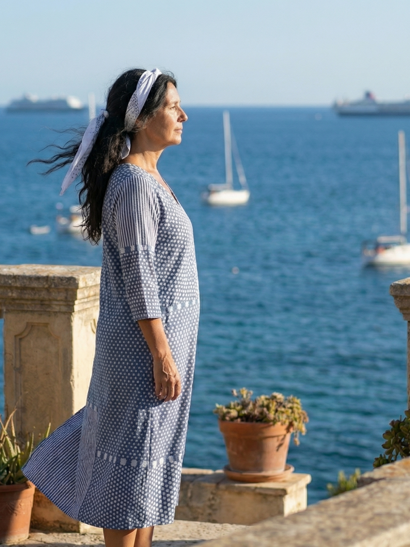 Flowy FJØRNA women's summer midi dress with long sleeves, wrap design, breathable fabric, perfect for warm weather.