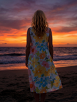 FJØRNA women's summer midi dress with short sleeves, flowy and lightweight fabric, perfect for warm weather.