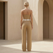 FJØRNA women's pinstripe strapless wide-leg jumpsuit, stylish set with a fitted bodice and flowing pant legs, perfect for summer wear.