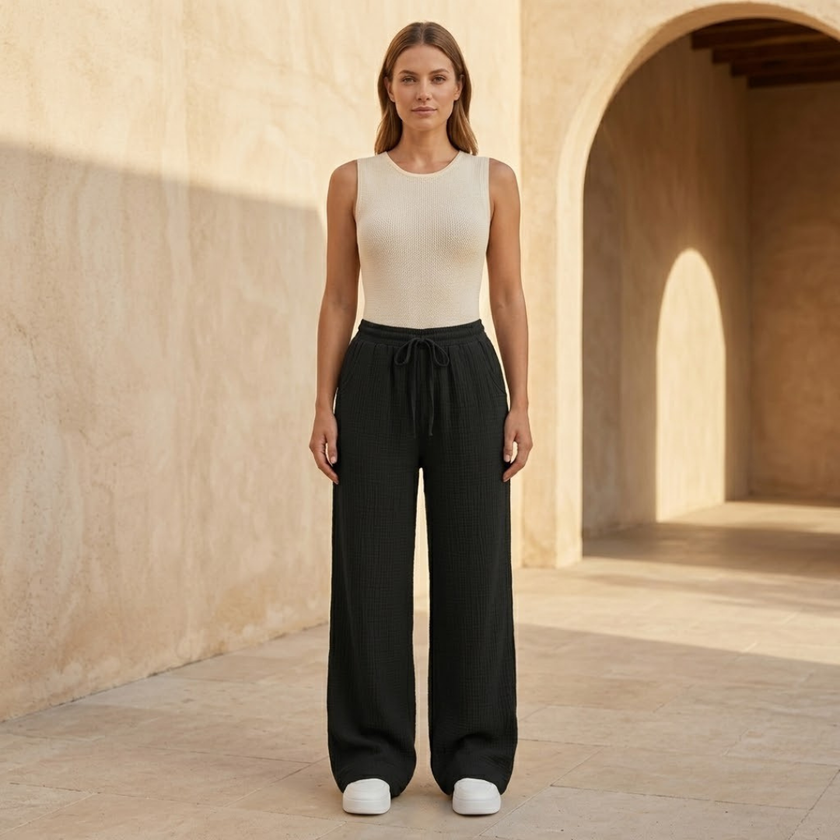 Women’s lightweight cotton wide leg trousers by FJØRNA, casual stylish pants with relaxed fit and comfortable design.
