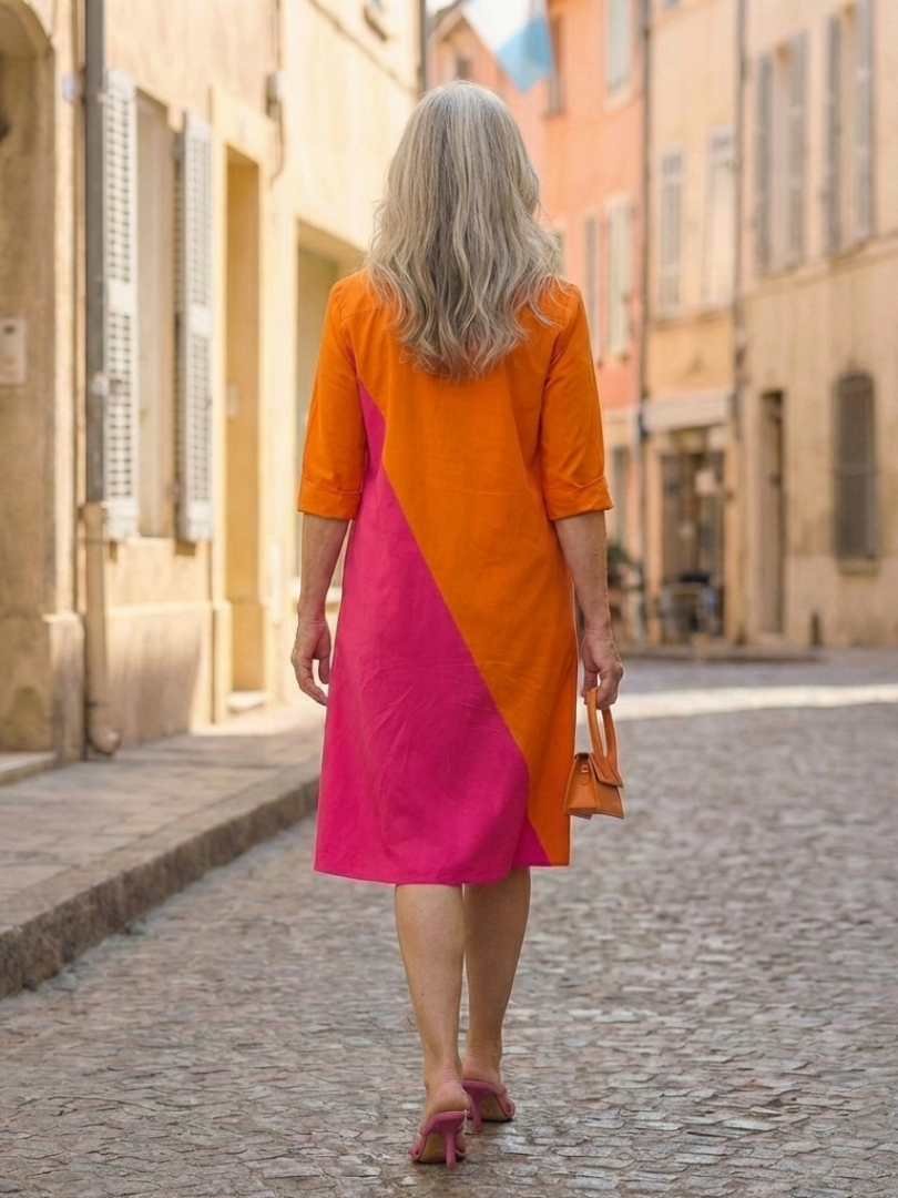 FJØRNA women's summer dress with pockets, flowy and lightweight, featuring a relaxed fit and soft fabric for warm weather wear.