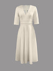 Navy FJØRNA wedding guest flared midi dress for women, elegant midi dress suitable for wedding guests, stylish and sophisticated.