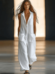 White linen sleeveless wide-leg jumpsuit for women by FJØRNA, shown hanging with a relaxed fit and wide-leg silhouette.