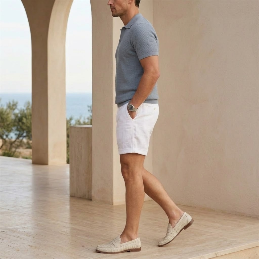 Men's cotton linen shorts by FJØRNA, tailored relaxed fit with front pockets, displayed on a neutral background.