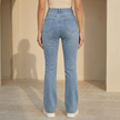 Women’s high waist bootcut jeans by FJØRNA, slim fit pants, shown in dark denim with classic five-pocket design.