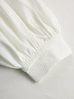 Cream textured lantern sleeve two-piece pants set by FJØRNA featuring stylish lantern sleeves and comfortable fit.