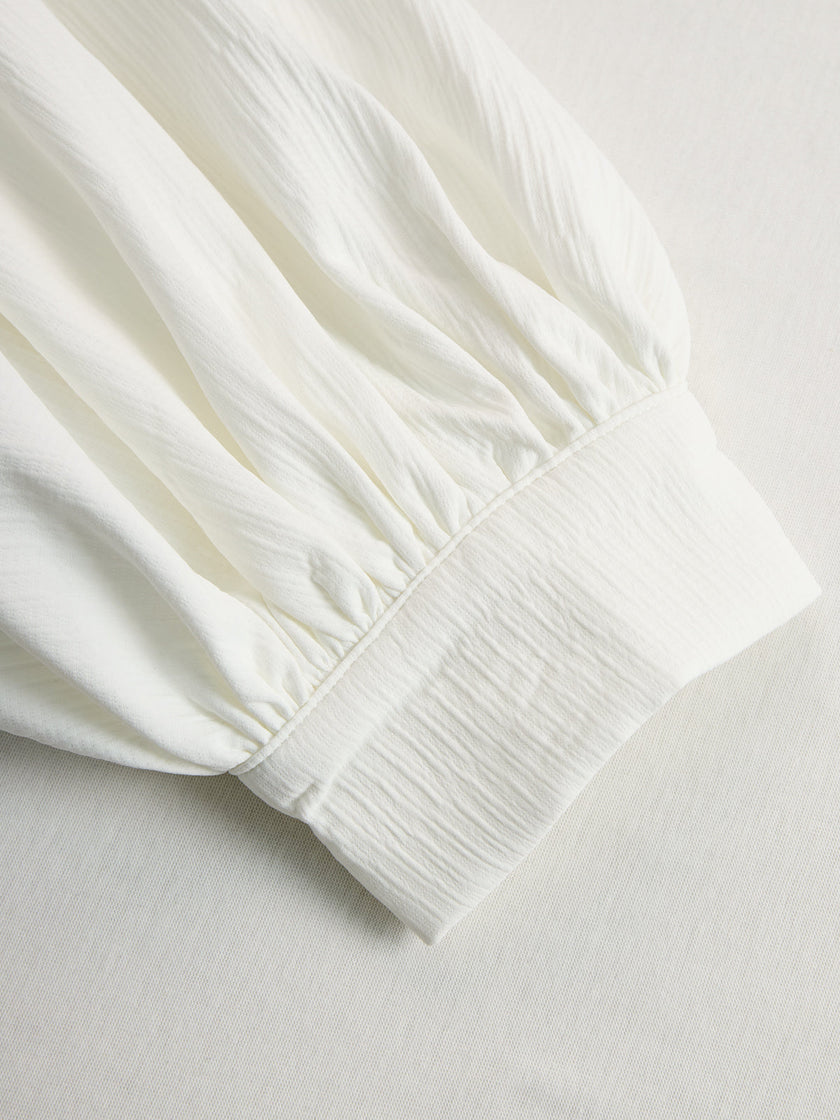 Cream textured lantern sleeve two-piece pants set by FJØRNA featuring stylish lantern sleeves and comfortable fit.