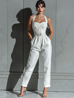Ivory cotton-linen women's jumpsuit with V-neck, cinched waist, and wide-leg pants by FJØRNA.