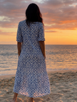 FJØRNA women's summer midi dress with geometric pattern, short sleeves, and wrap design, perfect for warm-weather occasions.