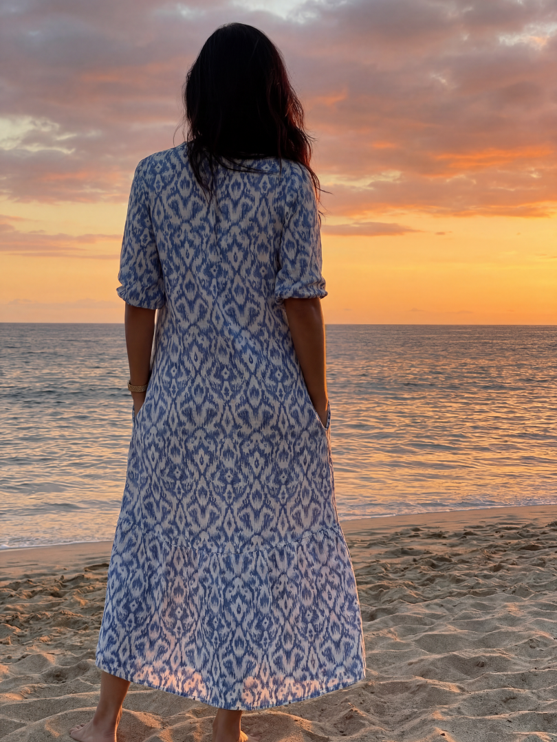 FJØRNA women's summer midi dress with geometric pattern, short sleeves, and wrap design, perfect for warm-weather occasions.