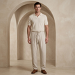 Men's lightweight linen blend trousers by FJØRNA, casual summer pants in neutral fabric, relaxed fit and breathable design.