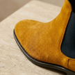 Tan suede Chelsea boots for men by FJØRNA, stylish slip-on shoes with elastic side panels and a sleek, modern design.