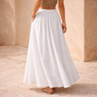 High-waist maxi skirt for women by FJØRNA, flowing and stylish, shown in a natural pose with soft fabric details.