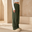 FJØRNA men's corduroy wide-leg trousers with relaxed fit, showing the textured fabric and stylish silhouette.