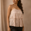 FJØRNA men's sequin top, stylish and shiny, featuring a fitted design with sequin embellishments on the black fabric.