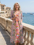 FJØRNA women's floral summer midi dress with long sleeves, wrap design, flowy fabric, perfect for warm weather occasions.