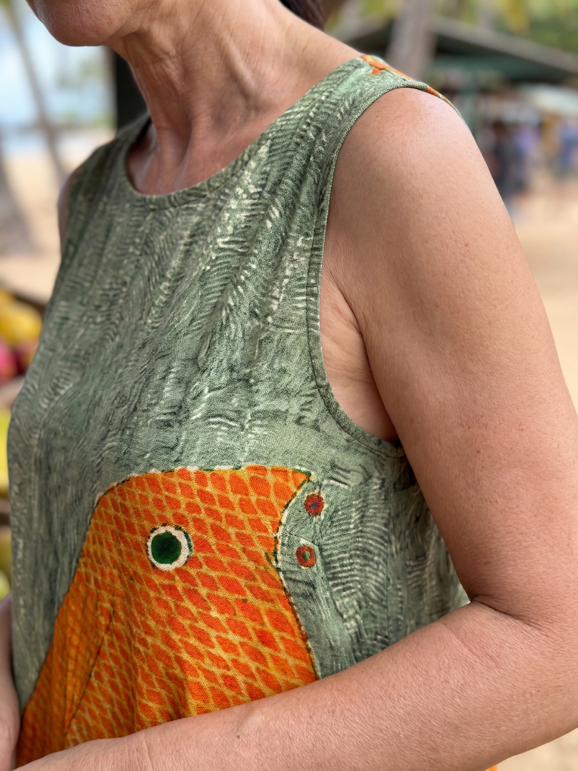 FJØRNA women's summer midi dress featuring a colorful printed sleeveless wrap design, perfect for warm weather.