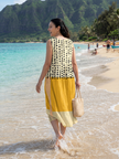 FJØRNA women's summer midi dress with sleeveless design and polka dot pattern, perfect for warm weather and casual occasions.