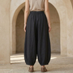 FJØRNA linen blend harem trousers for women with elastic waist and relaxed fit, showcasing comfortable, flowy pant design