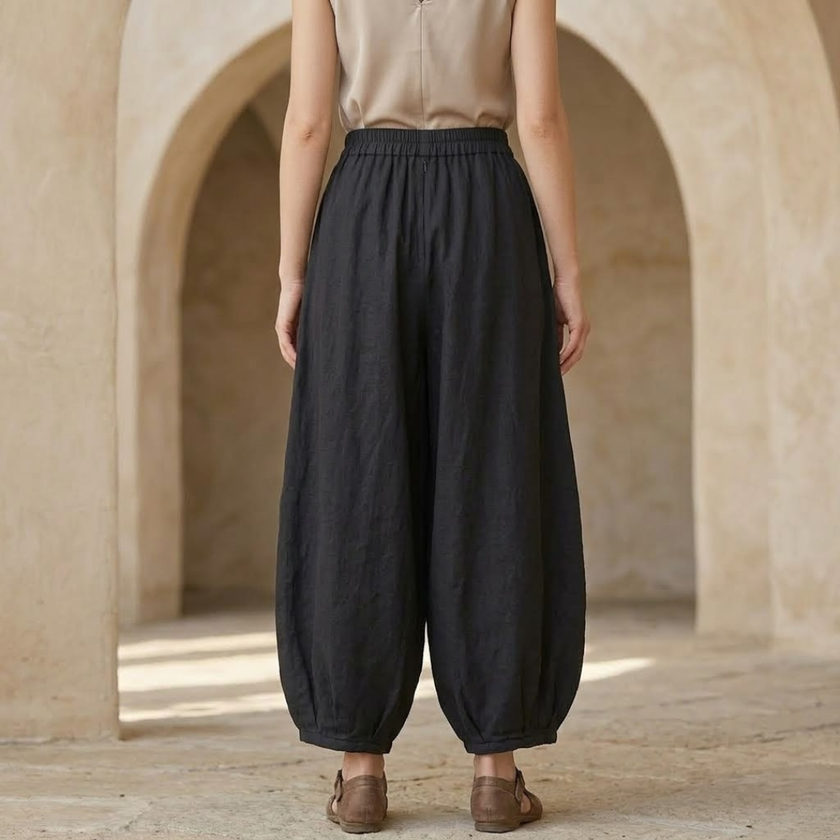 FJØRNA linen blend harem trousers for women with elastic waist and relaxed fit, showcasing comfortable, flowy pant design