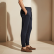 Men's FJØRNA joggers with drawstring, relaxed fit, and soft fabric, shown in a casual pose.