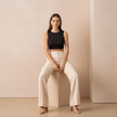 FJØRNA women's straight leg trousers, stylish and comfortable pants with a classic fit, shown in a neutral fabric on a model.