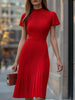 FJØRNA elegant red pleated midi dress displayed on a hanger with flowing fabric and detailed pleats.