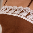 Women's cotton camisole top with lace trim by FJØRNA, sleeveless summer top with delicate lace details.