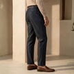 FJØRNA men's high waist straight leg trousers, stylish pants with a sleek fit and classic design, shown on a model.