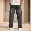 Relaxed fit men's denim jeans by FJØRNA showing classic blue denim with five-pocket design and stitched seams.