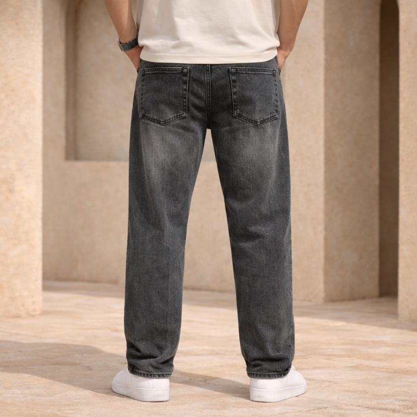 Relaxed fit men's denim jeans by FJØRNA showing classic blue denim with five-pocket design and stitched seams.