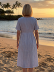 FJØRNA summer midi dress for women with striped pattern, short sleeves, and pockets, perfect for warm weather.
