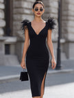 Black Feather-Accented Deep V Bodycon Midi Dress by FJØRNA, showing the fitted dress with feather details on the shoulder.