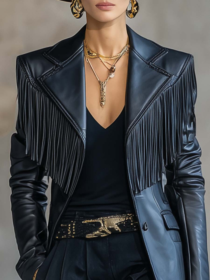 Black faux leather tassel blazer with notch lapel by FJØRNA, stylish jacket featuring tassel details and tailored fit.