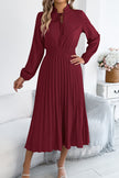 FJØRNA solid color long-sleeved fitted waist pleated elegant midi dress displayed on a hanger.