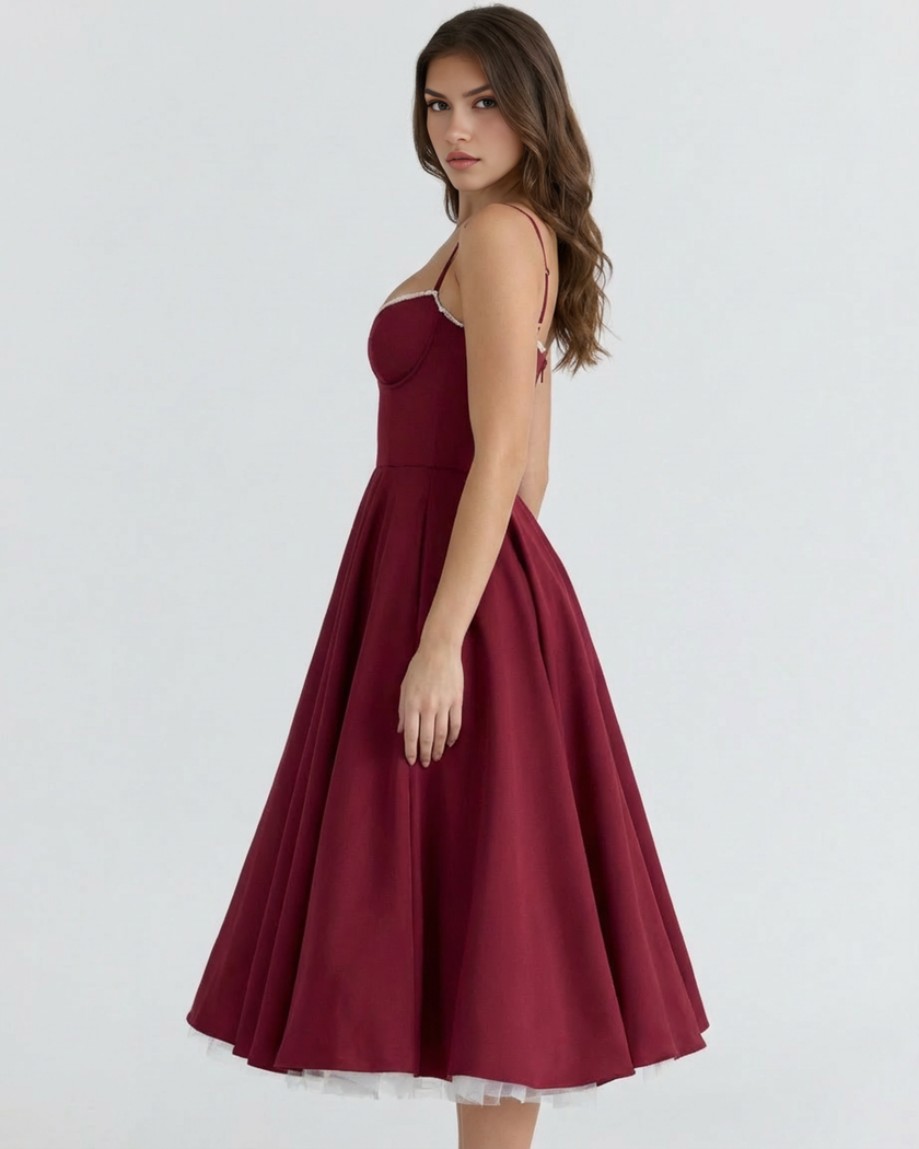 FJØRNA women's corset midi dress with tulle skirt, featuring a fitted bodice and flowing layered tulle for elegant style.
