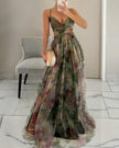 Elegant floral maxi dress for women with a V-neck by FJØRNA, showcasing a flowing design and vibrant print.