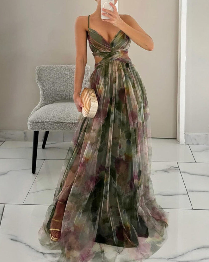 Elegant floral maxi dress for women with a V-neck by FJØRNA, showcasing a flowing design and vibrant print.