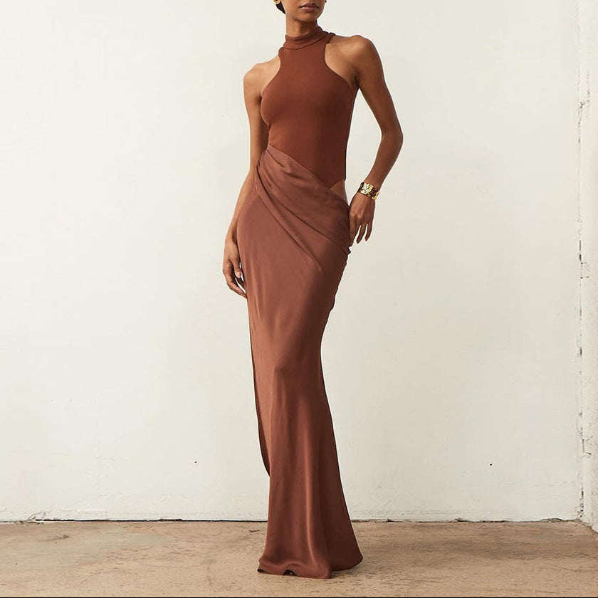 FJØRNA elegant halter draped evening dress featuring flowing fabric and sophisticated design, perfect for formal occasions.
