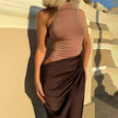 FJØRNA elegant halter draped evening dress, showcasing a flowing fabric design with a stylish halter neckline and sophisticated style.